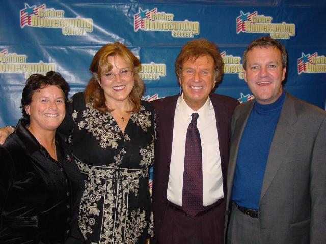 Photo to Right: Marsha Stevens, second from left (an open lesbian who's career is singing Gospel music) with her wife, Cindy. The man to the right of Marsha is Southern Gospel Music legend, Bill Gaither. Marsha had just performed on the show at a Gaither Homecoming concert. Far right is Mark Lowry. 